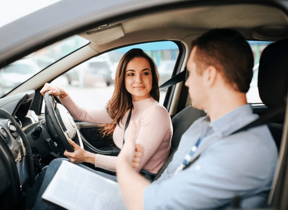 Driving student in the car listening to instructions from the driving instructor at UNO Driving School.
