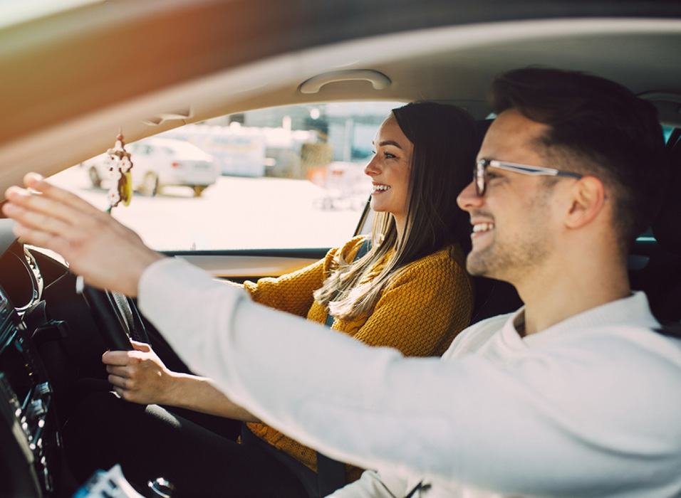 Driving stutend in the car taking directions from the driving instructor from UNO driving school.